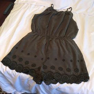 Green Juniors Romper with lining in leg area.